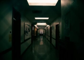a long hallway with a skylight hanging from the ceiling
